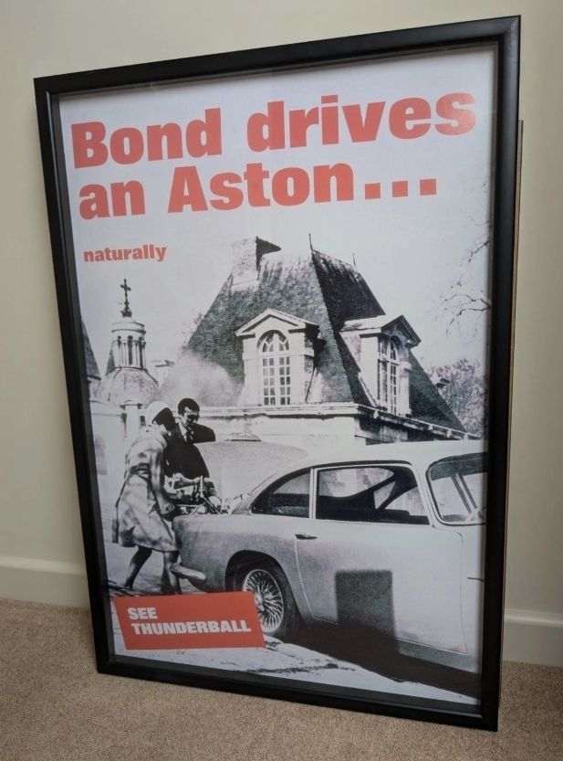 Bond Drives An Aston Framed Reproduction Poster. James Bond 007. Aston Martin