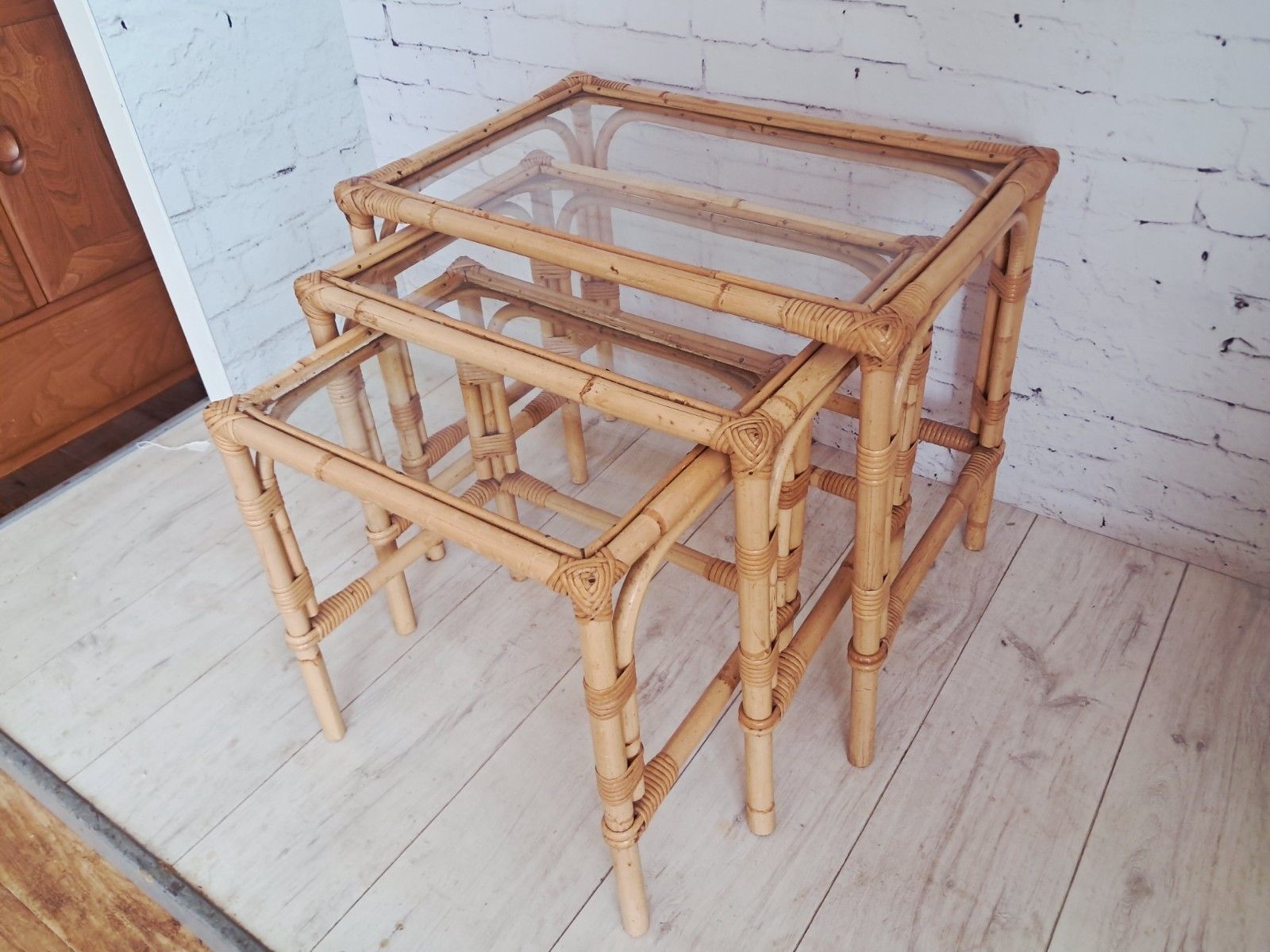 photo furniture Vintage Bamboo Nest Tables Trio Glass Top Rattan Side Tables Boho Coastal 1970s