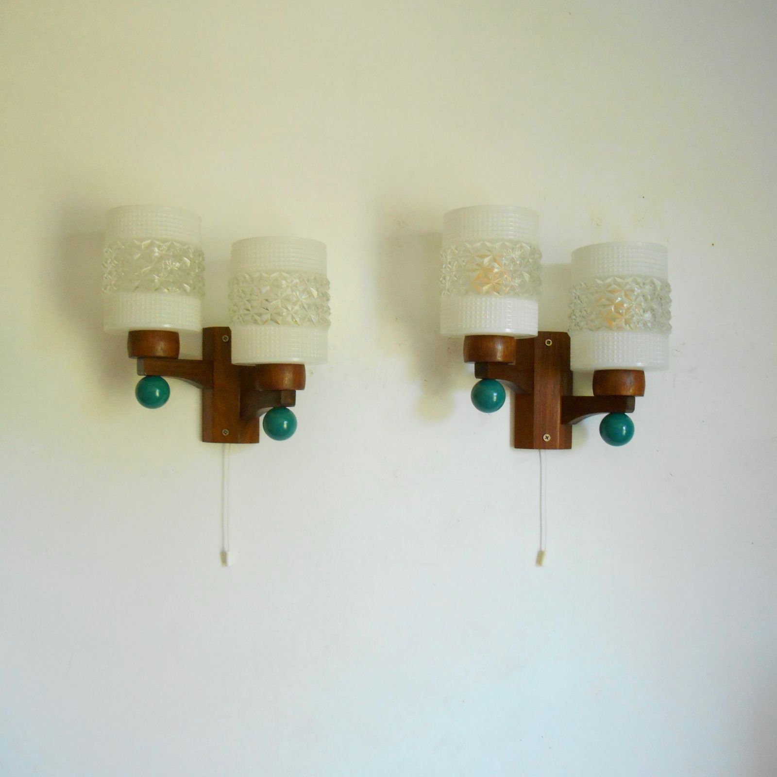 A Pair Of Mid Century Modern Dual Stem Teak Wall Lamps