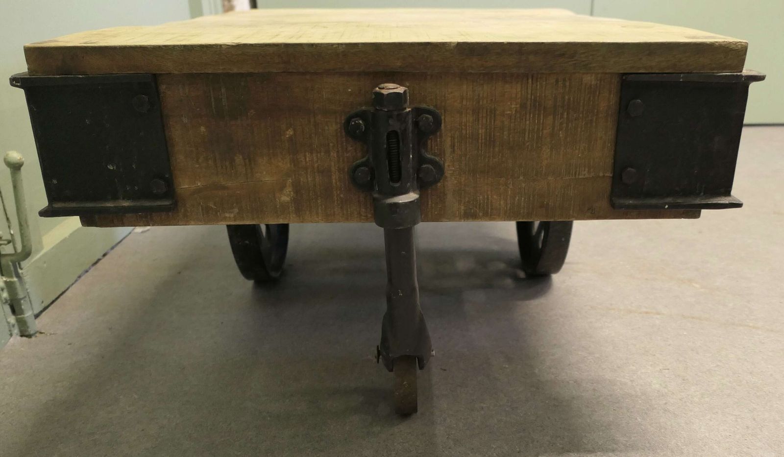 A Unique Wood Framed Industrial Coffee Table The Table Has A Thick Wooden Top photo 1260.0