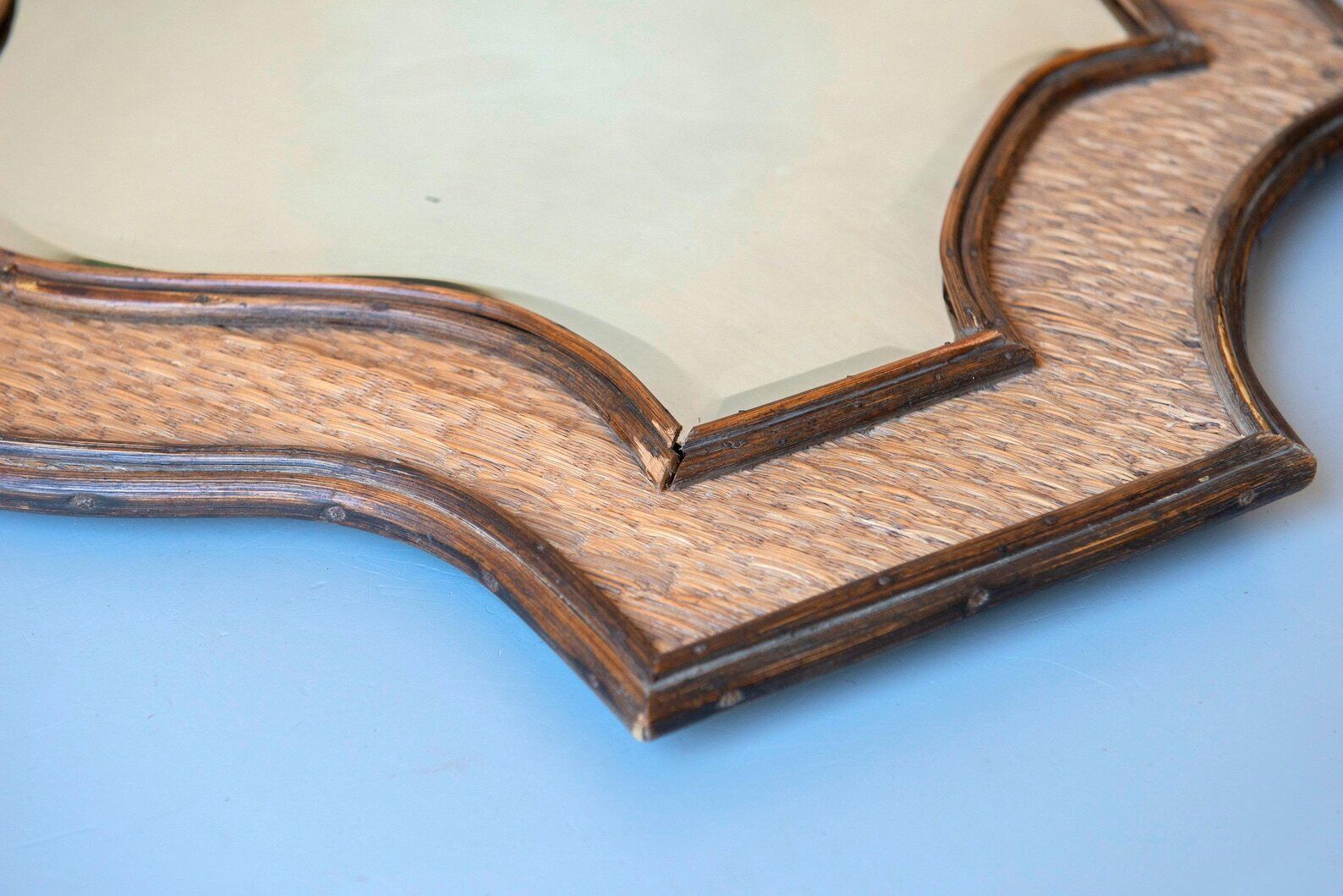 photo vintage Vintage Shield Mirror Large Rattan Wicker Frame Beveled Glass Coastal Wall Decor