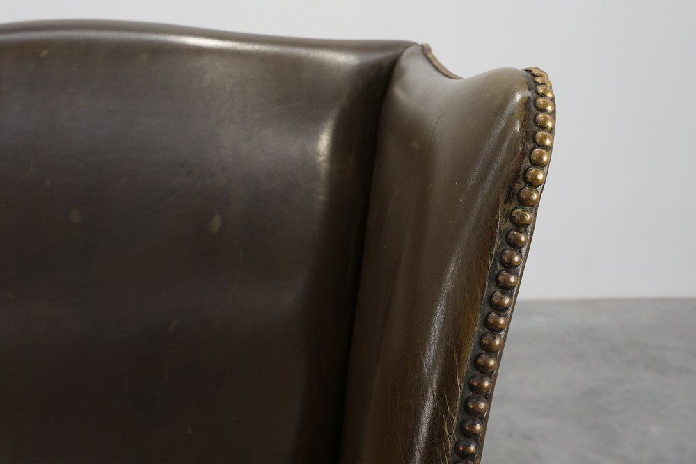 photo furniture Mid Century Modern Wing Back Chair In Green Leather, 1980s