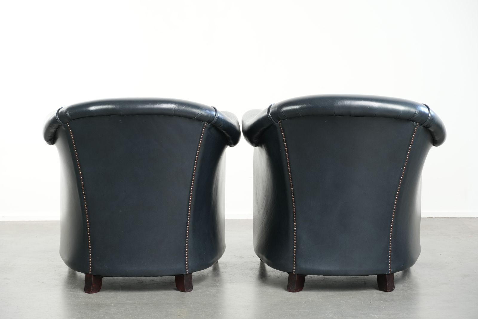 Beautiful And Comfortable Set Of Dark Blue Cowhide Club Armchairs With A Unique And Timeless Design photo for sale