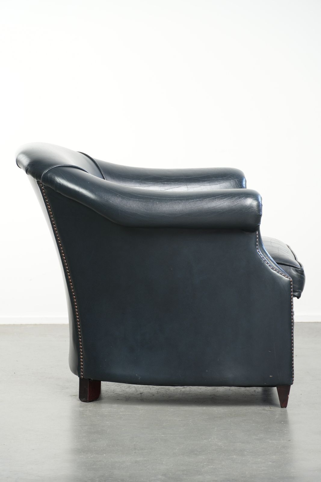 Dark Blue Club Armchair Made Of Cowhide Leather With A Timeless Design photo for sale