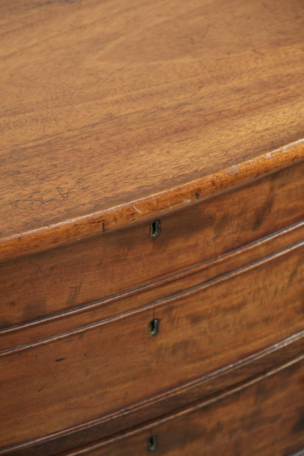 photo furniture Antique 19th Century English Bow Front Chest Of Drawers In A Unique, Subtle Size With Beautiful Warm Colors.