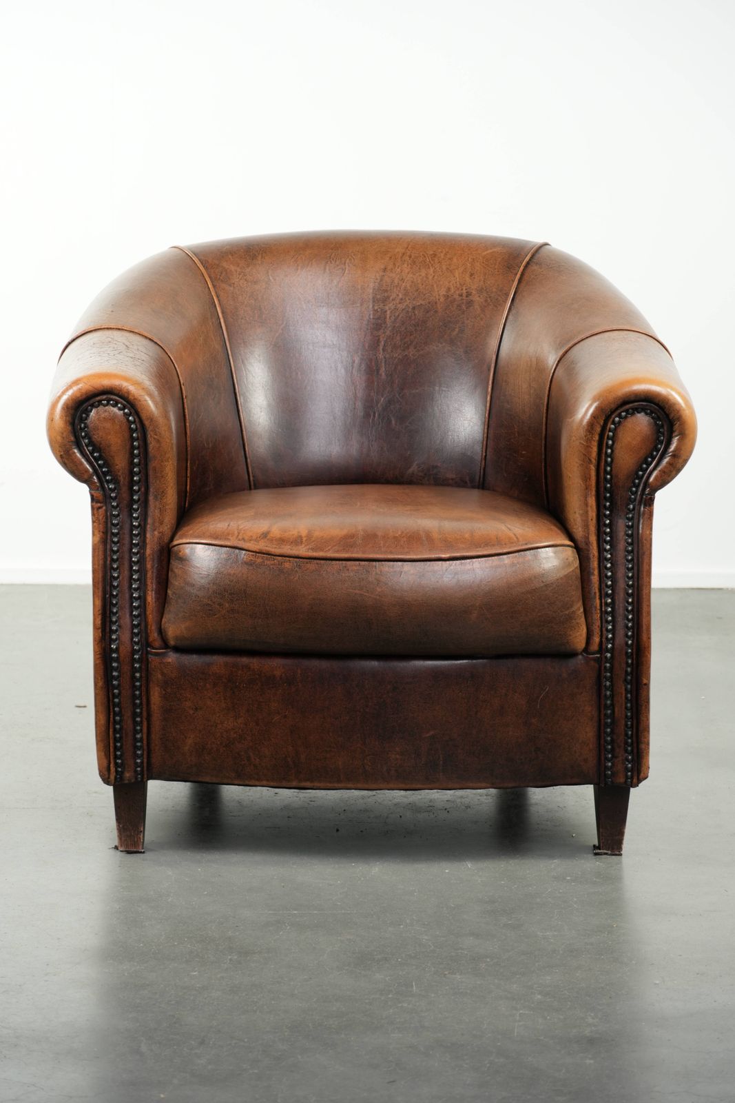 Characterful And Comfortable Club Armchair Made Of Sheepskin With A Fixed Seat Cushion And Excellent Colors photo furniture