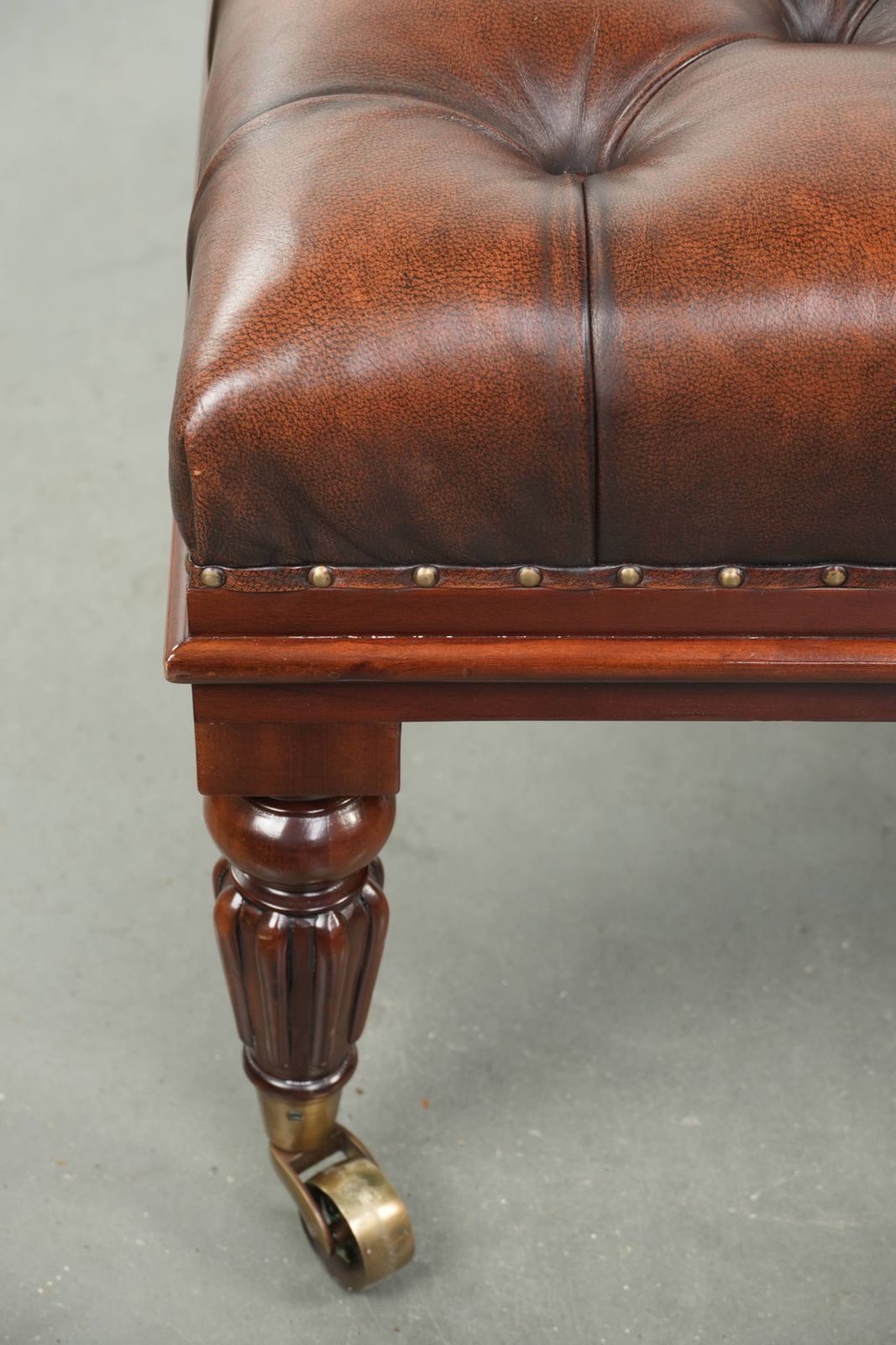 Large Brown Cowhide Chesterfield Ottoman In English Style With Elegant Legs And Brass Casters photo vintage
