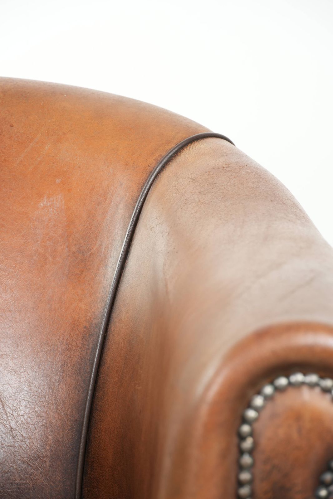 photo for sale Characterful And Comfortable Sheepskin Club Armchair With A Beautiful Patina And A Refined Finish With Black Piping.