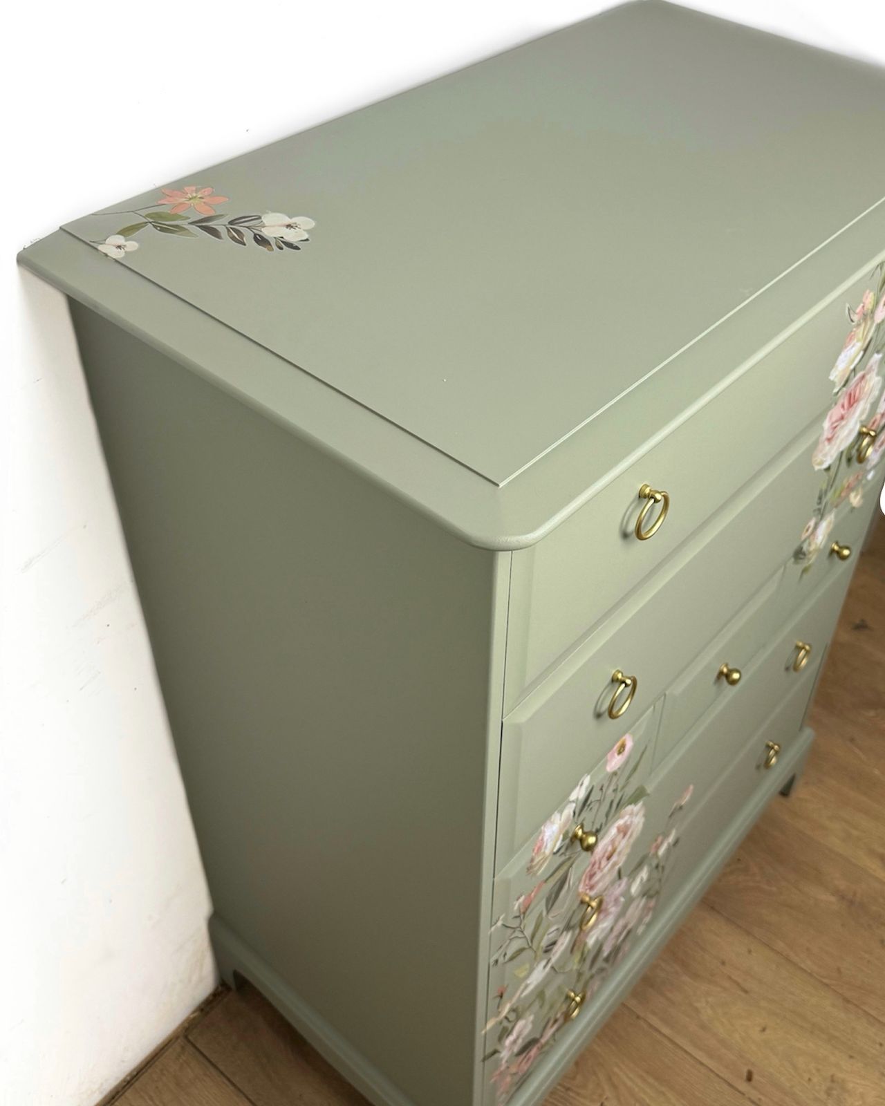 photo furniture Refinished Vintage Stag Minstrel Tallboy Chest Of Drawers In Pale Green With Floral Design In Pink