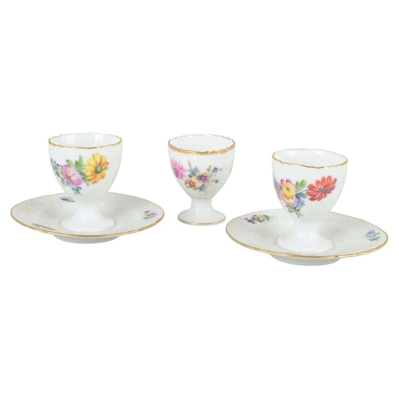 Royal Copenhagen Saxon Flower. Three Porcelain Egg Cups, Two With Fixed Saucers.