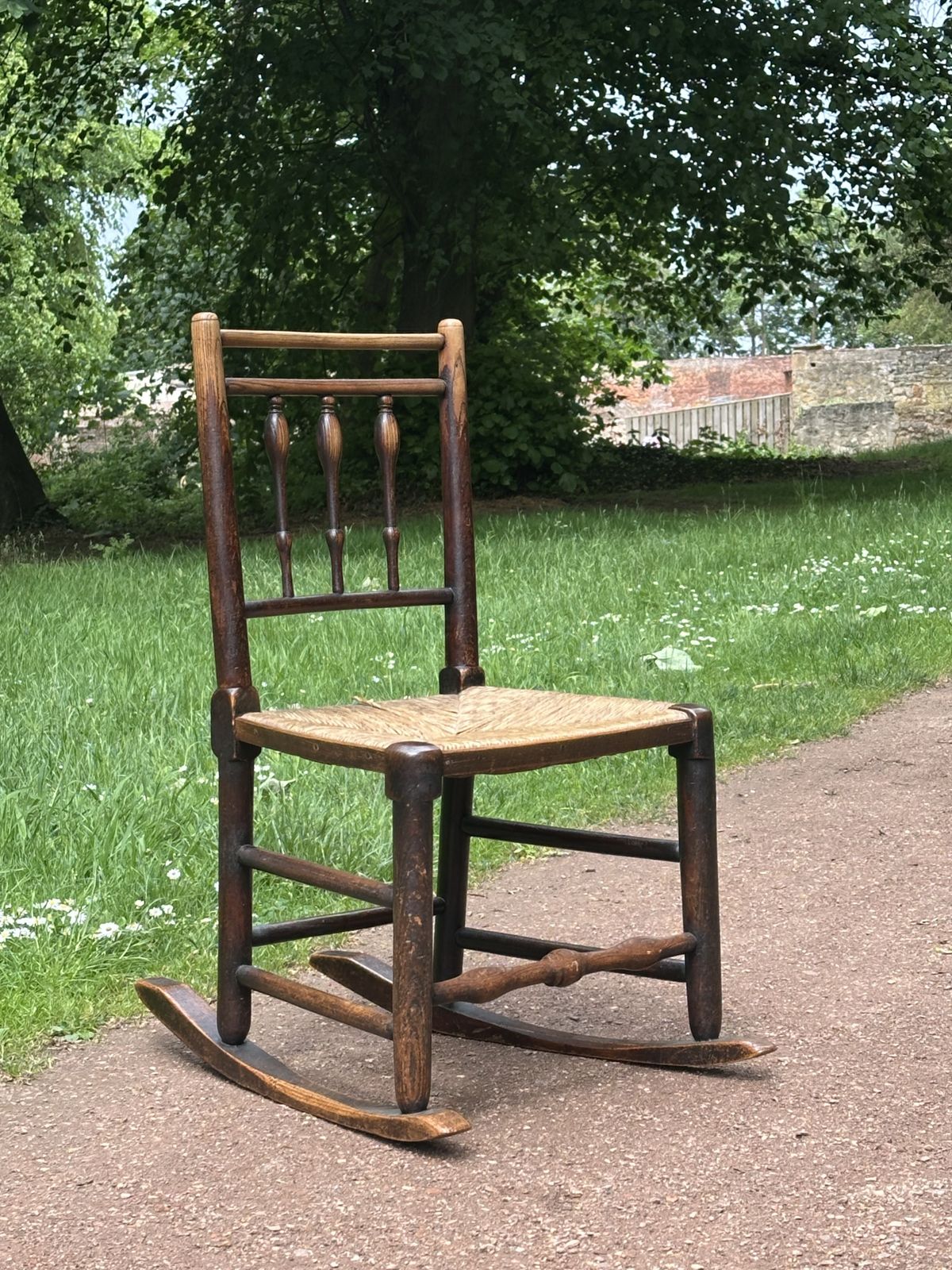 A Small George III Lancashire/Cheshire Stained Ash And Woven Rush Rocking Chair