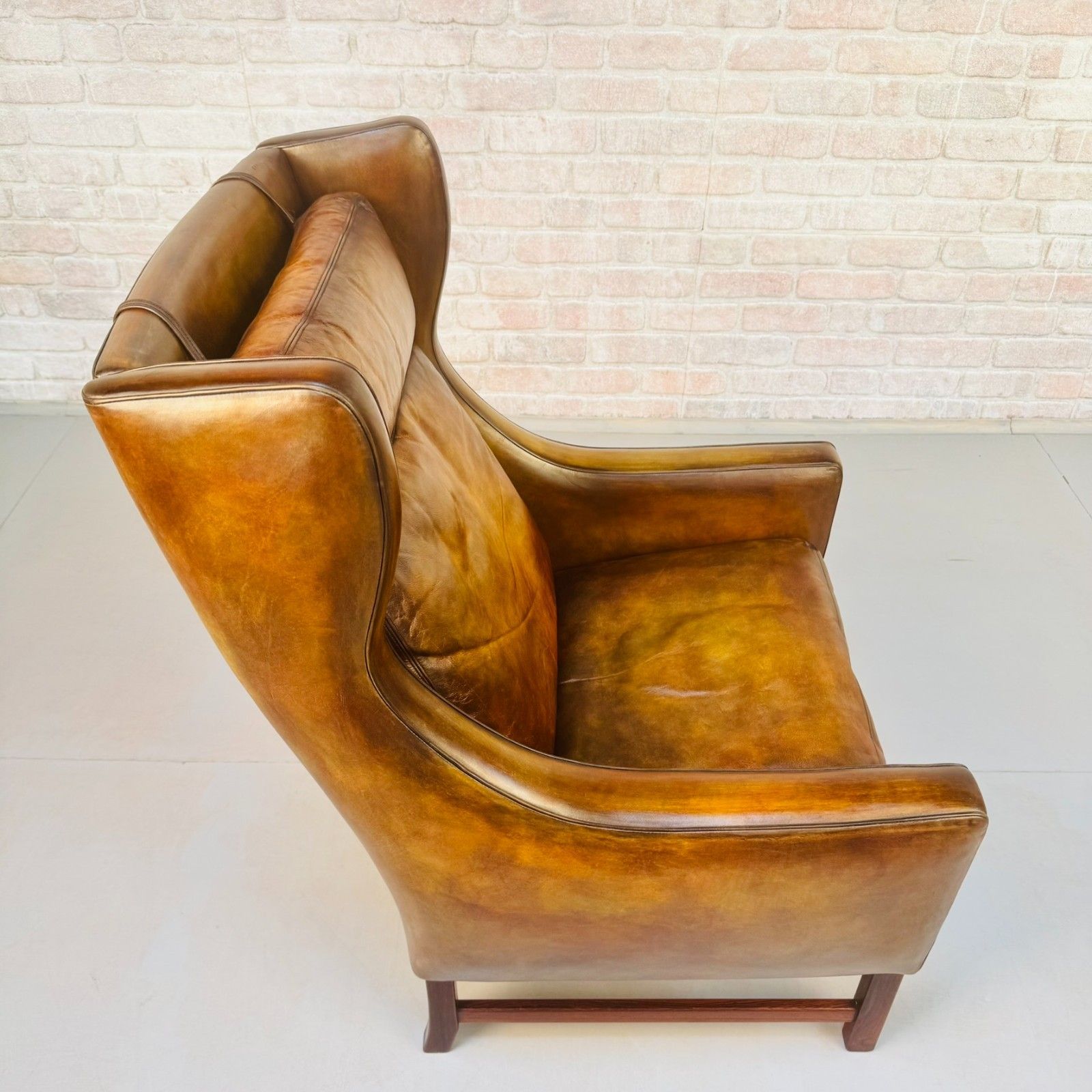 photo for sale Vintage 1960s Fredrik Kayser Wingback Tan Leather Chair For Vatne Møbler