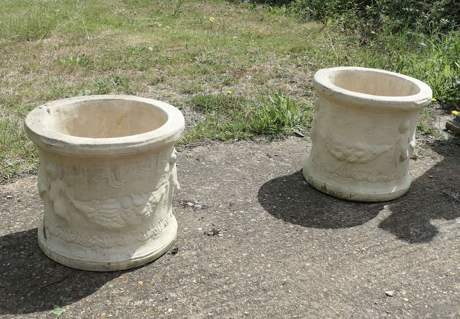 A Pair Of Round Garden Planters With Winged Cherubs This Is A Good Large Pair photo for sale