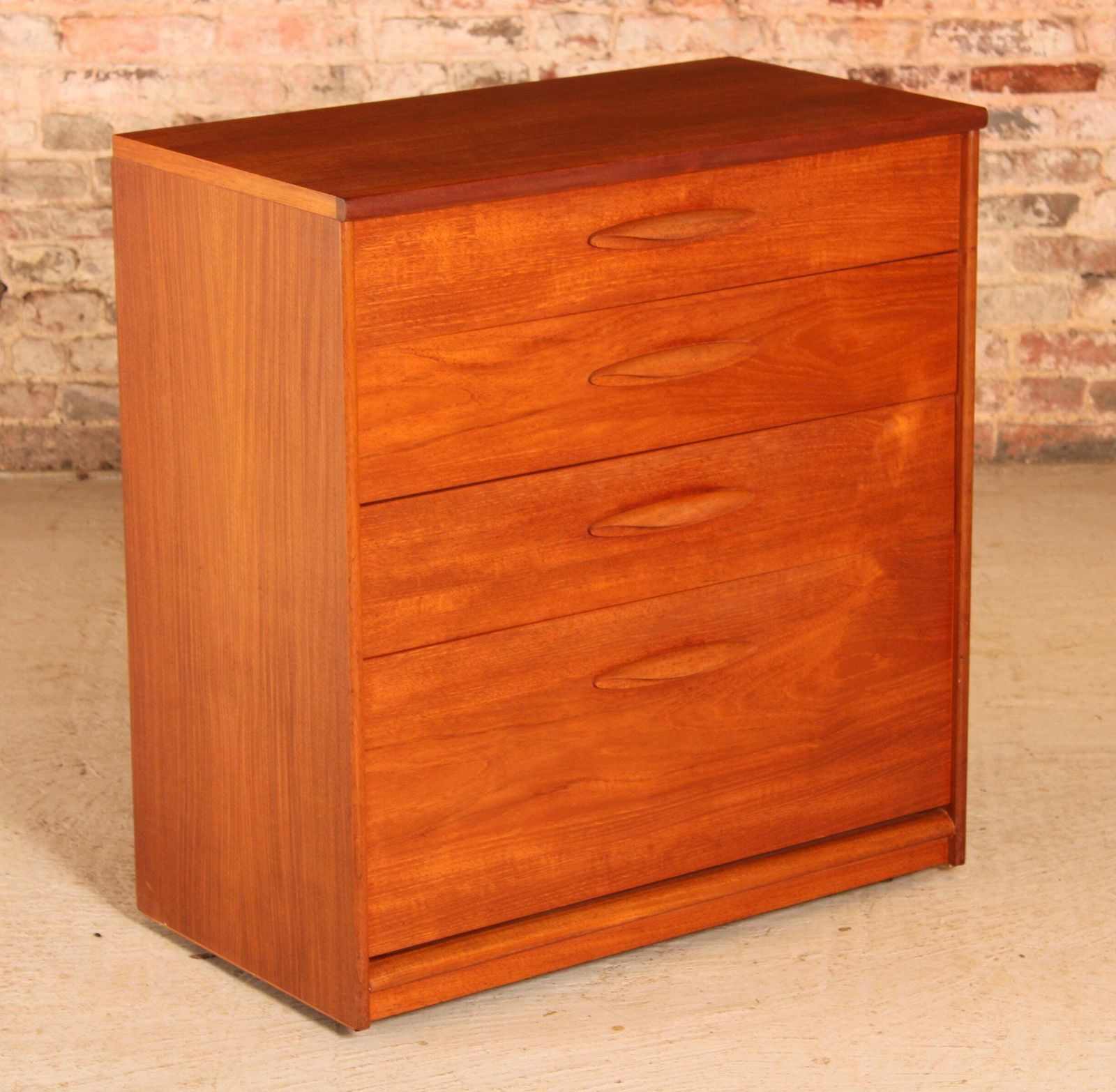 Mid Century Teak Chest Of 4 Drawers On Casters By Austinsuite, Circa 1960s photo for sale