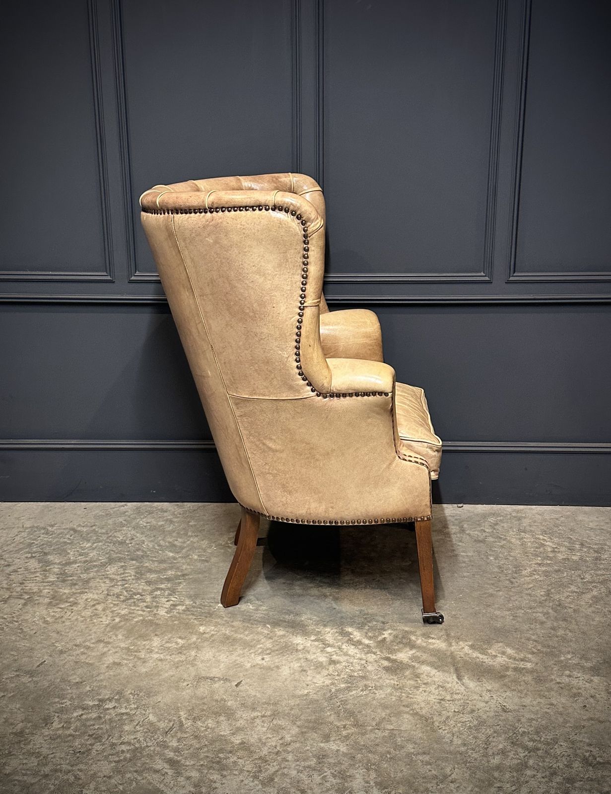 Buttoned Leather Porters Wing Chair photo vintage