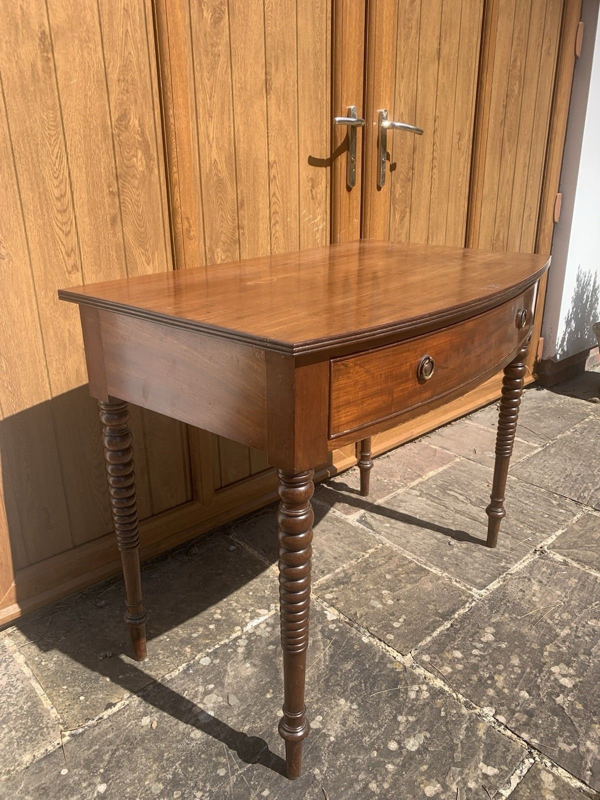 A Regency Bowfront Side Table With Bobbin Legs. photo for sale