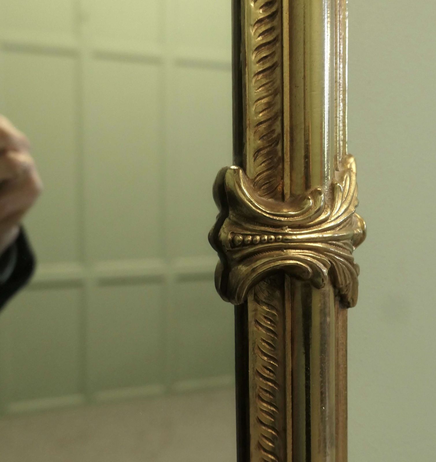 A Long Shaped Oval Brass Wall Mirror The Mirror Has A Decorative Acanthus Leaf Motif Aro photo furniture