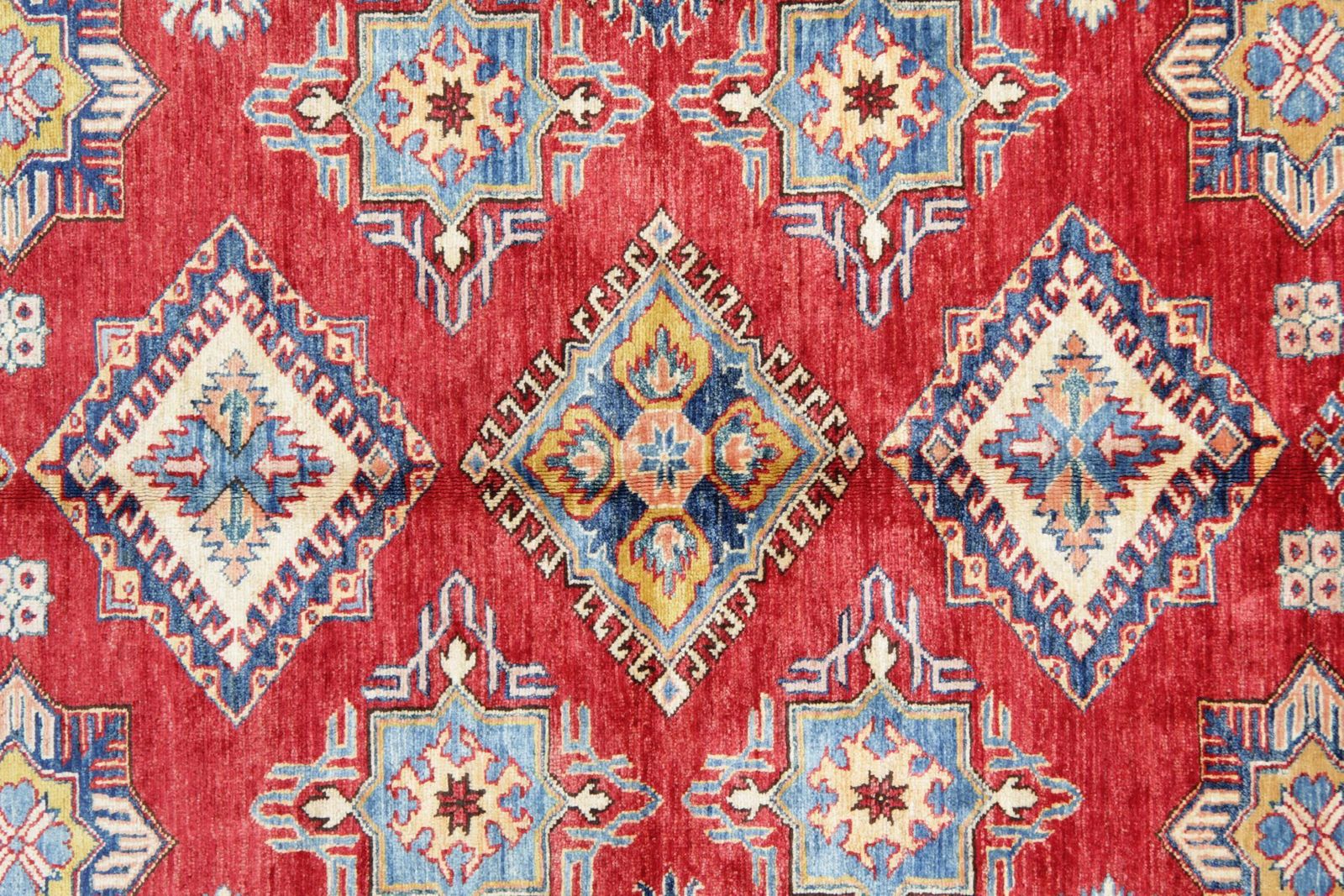 Tapis orientaux géométriques rouges, tapis fait main ivoire. photo Textiles