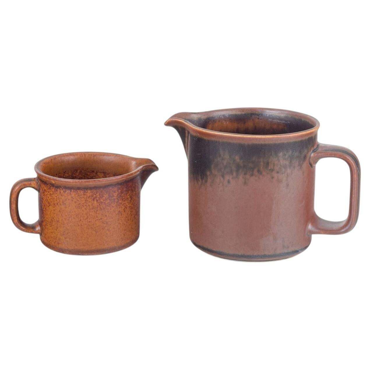 Ulla Procopé For Arabia. Two Stoneware Pitchers With Brown Glaze. 1970s.