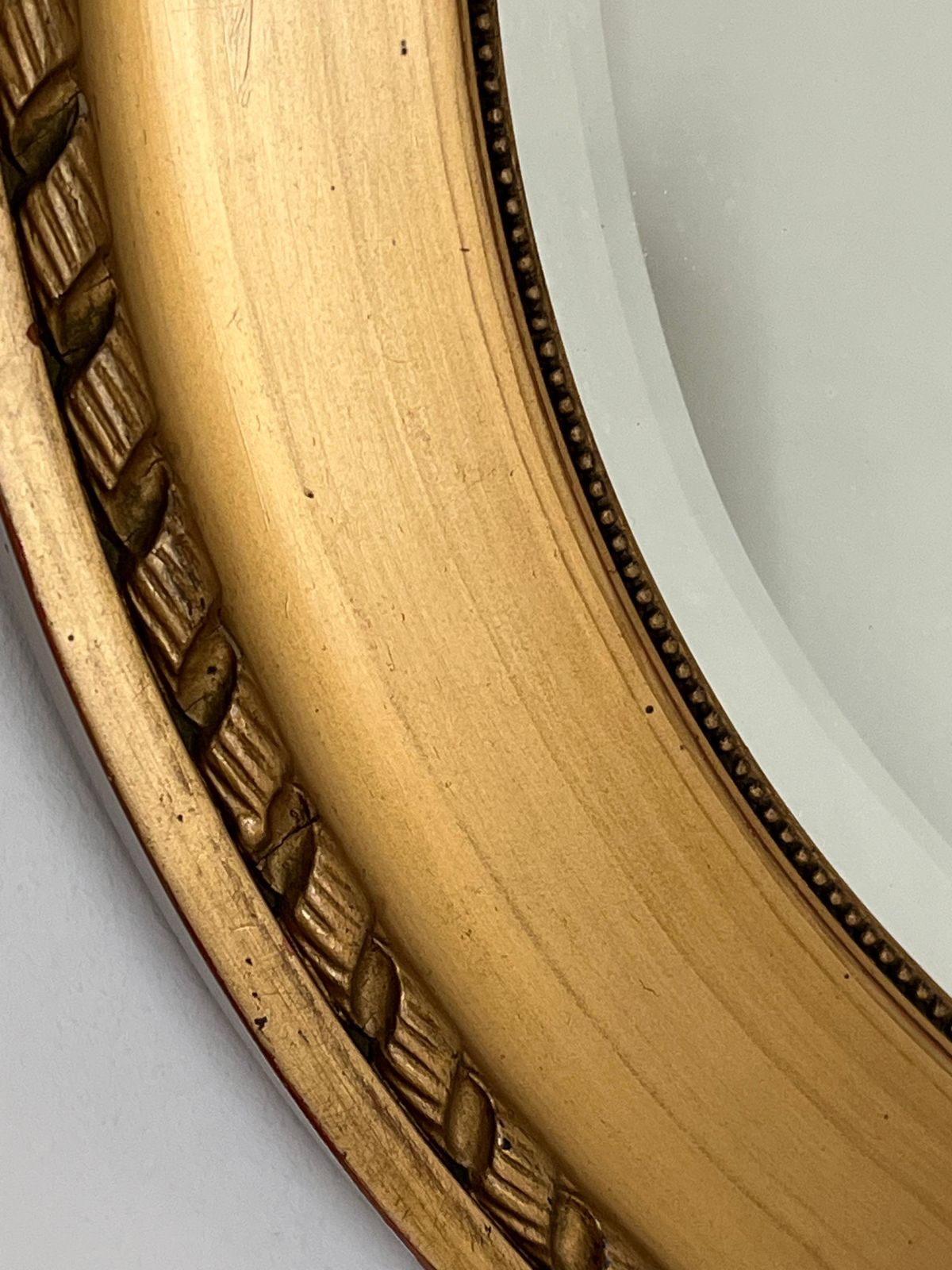 Ovale wandspiegel, vergulde lijst met touw- en kralendetail, facetglas, ca. 1890 photo buy