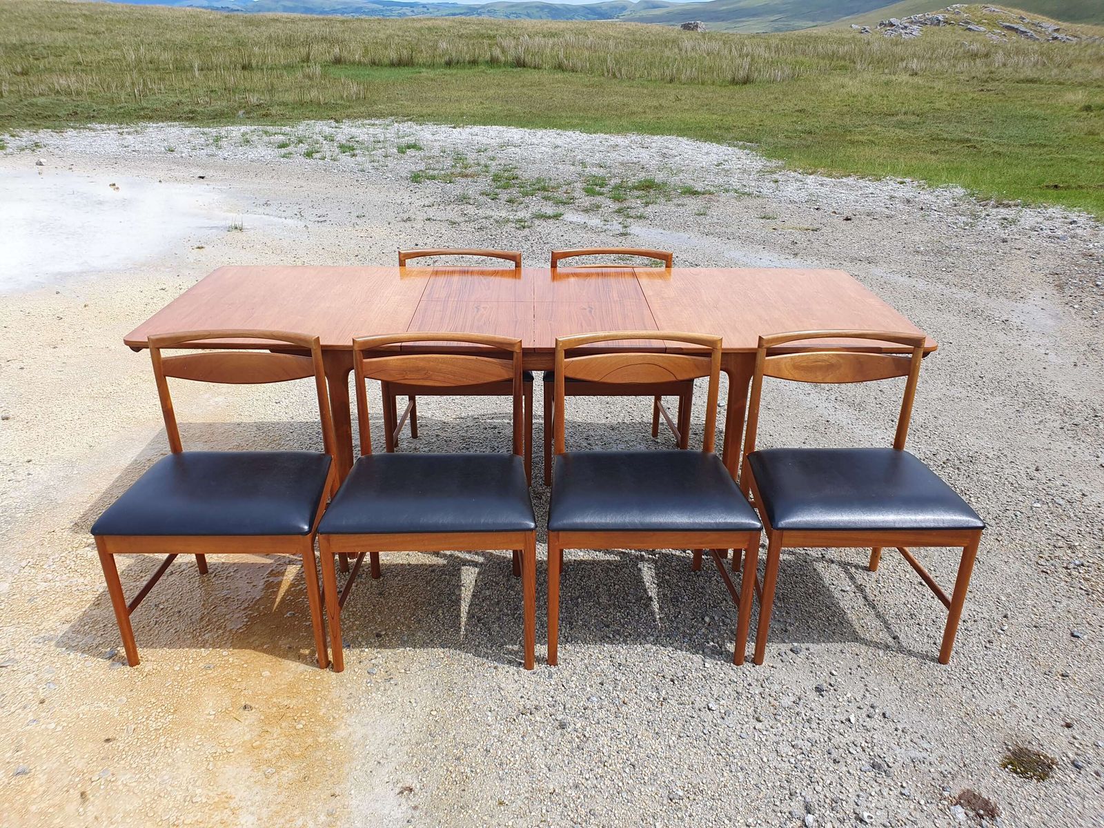 photo furniture A Mid 20thc Teak, Extending Dining Table And Six Chairs By McIntosh Of Kirkcaldy.