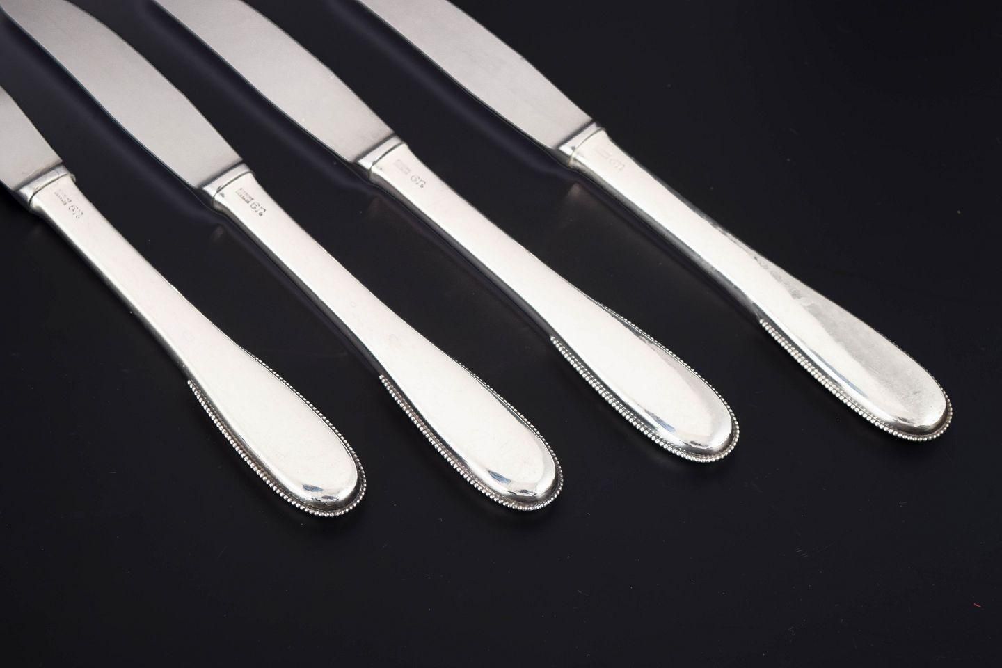 Evald Nielsen. Set van vier lunchmessen in sterling zilver en roestvrij staal. photo for sale