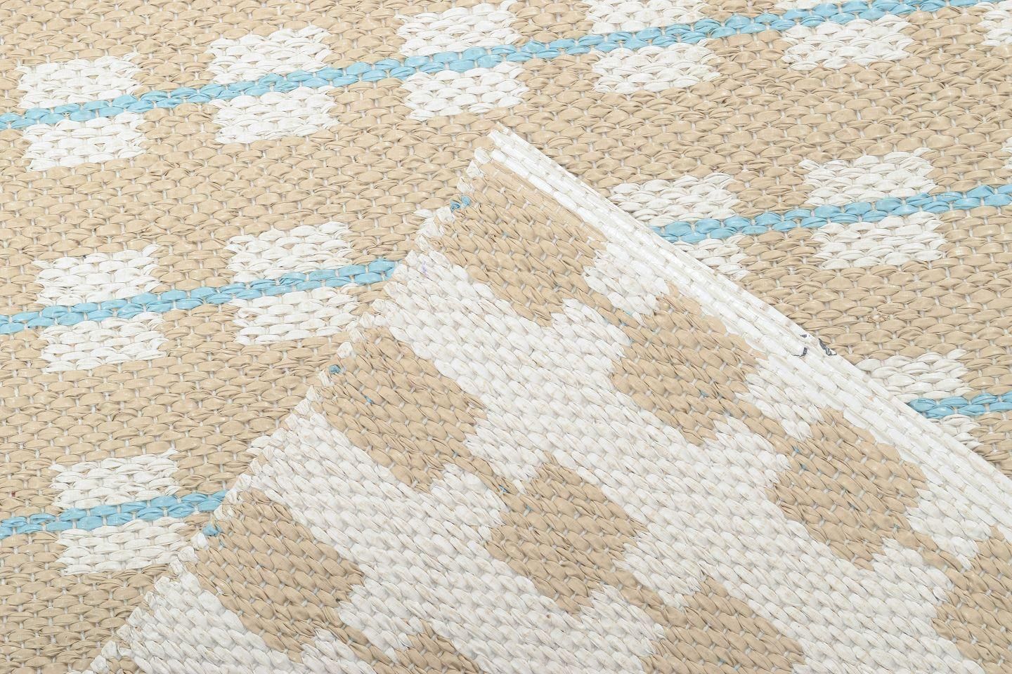 Scandinavian Designer. Rectangular Runner In Woven Plastic With Graphic Pattern. photo Textiles