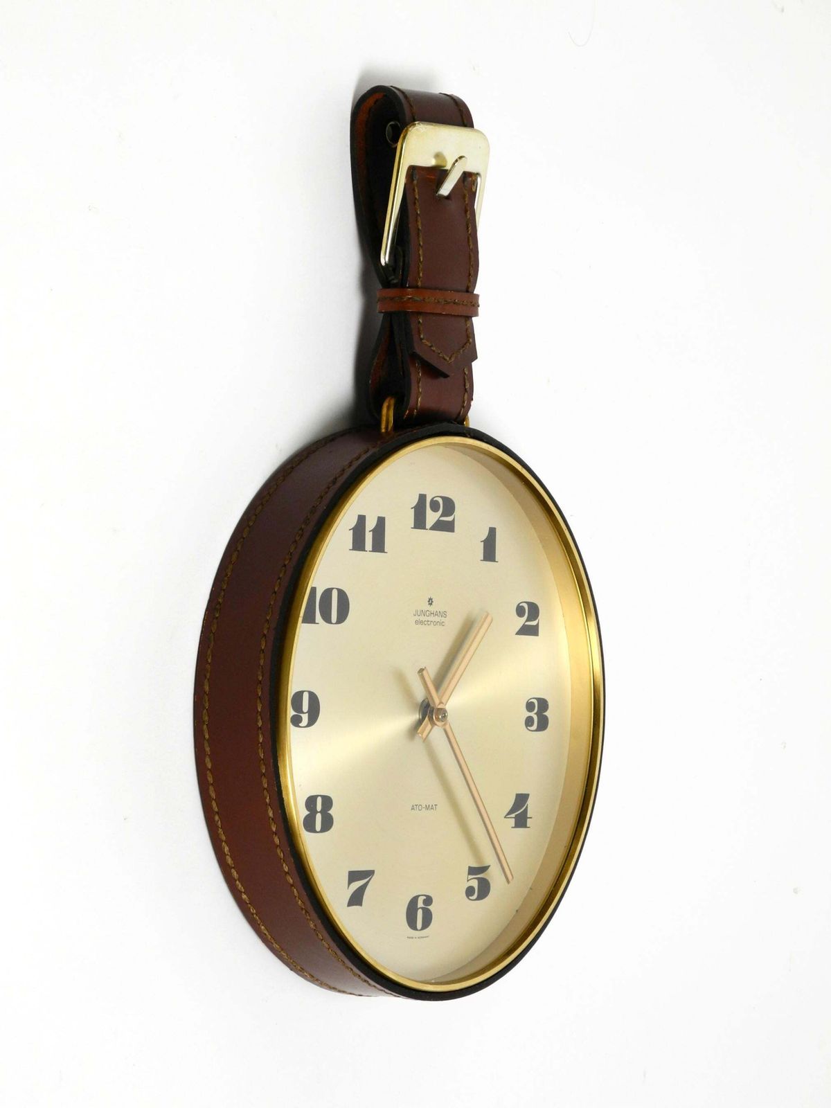 Junghans Messing Wandklok uit de jaren 1960 met Lederen Ophangband photo furniture