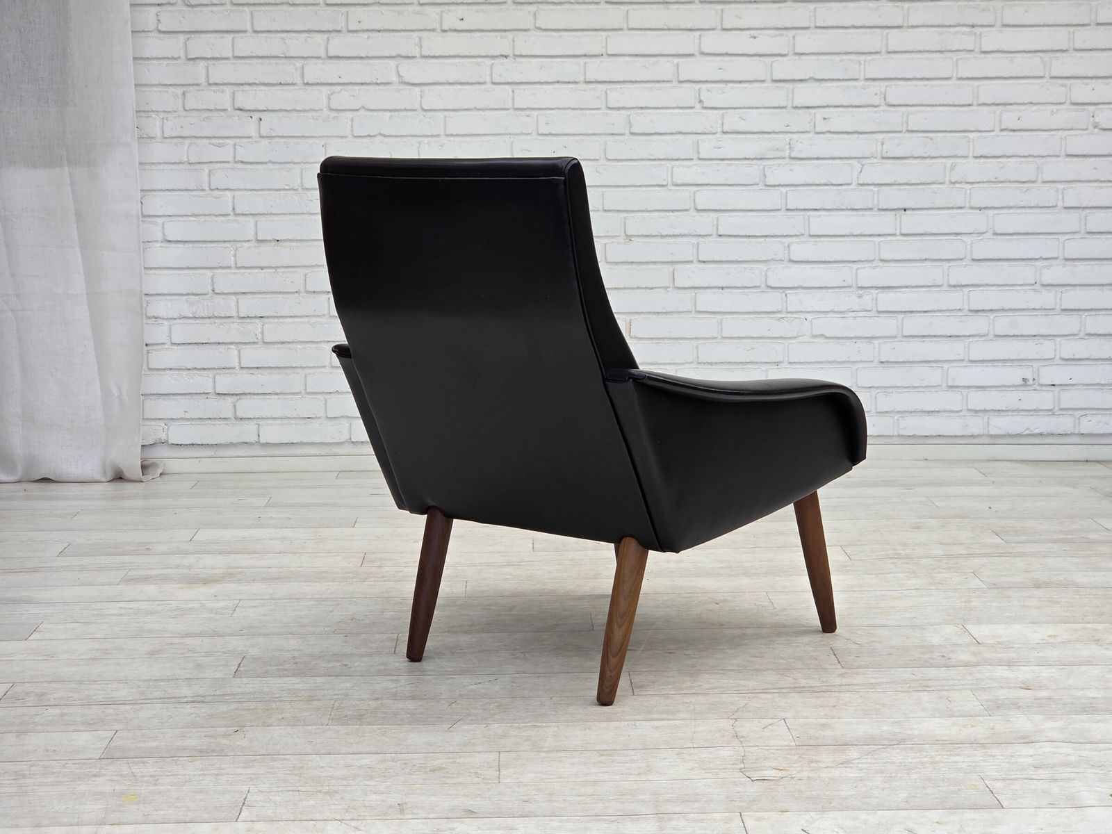 photo furniture 1970s, Danish Armchair, Black Artificial Leather, Teak Wood Legs.