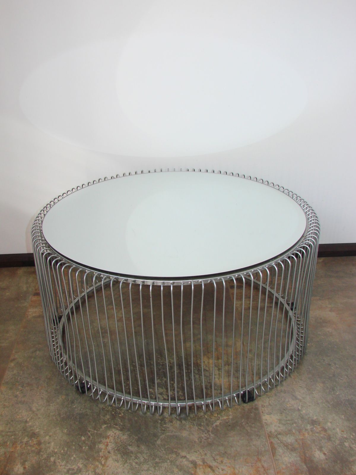 A Round Coffee Table With A Mirrored Top, From The 1990s. photo for sale