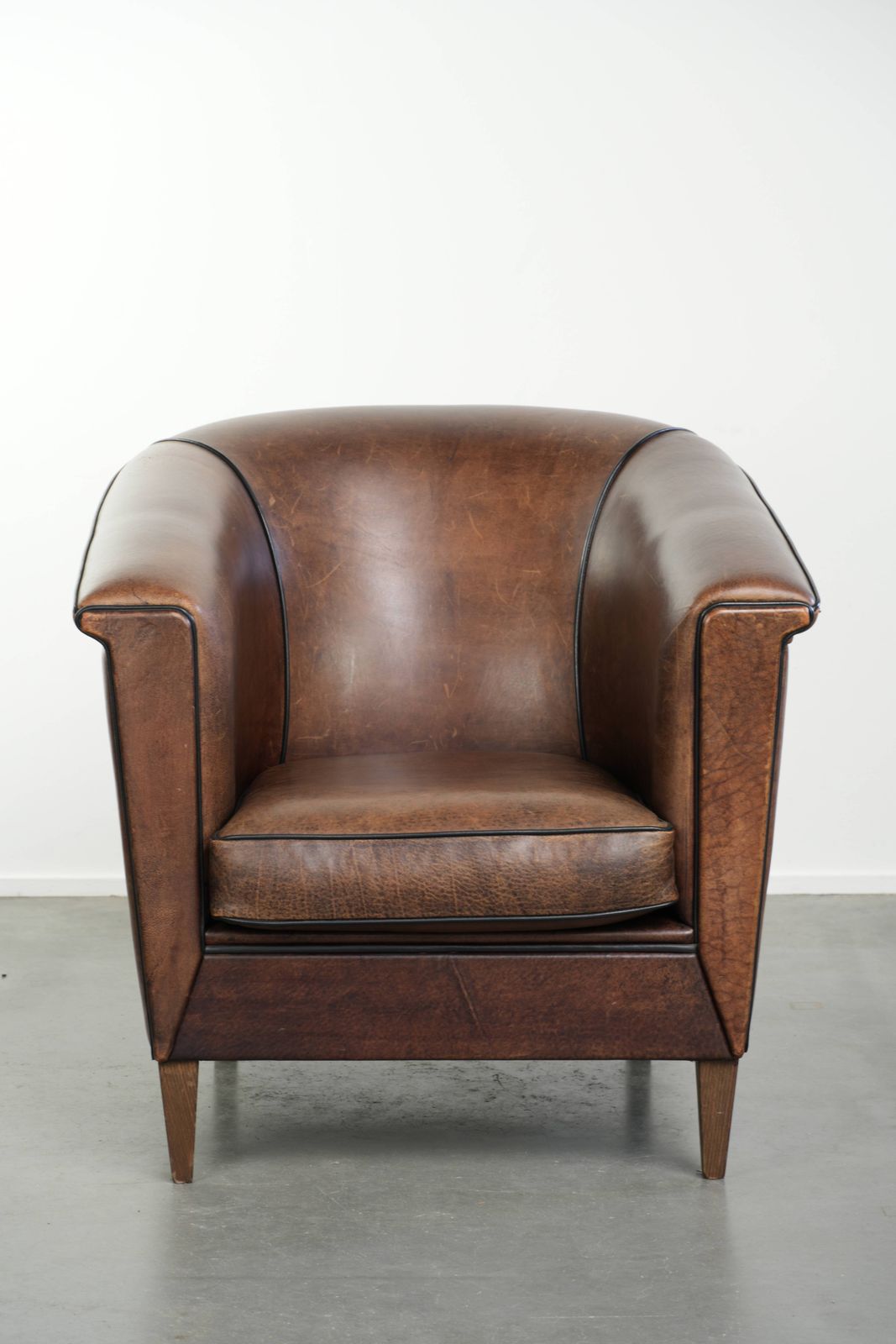 Nice And Sleek Art Deco Designed Sheepskin Club Armchair Finished With Black Piping photo furniture