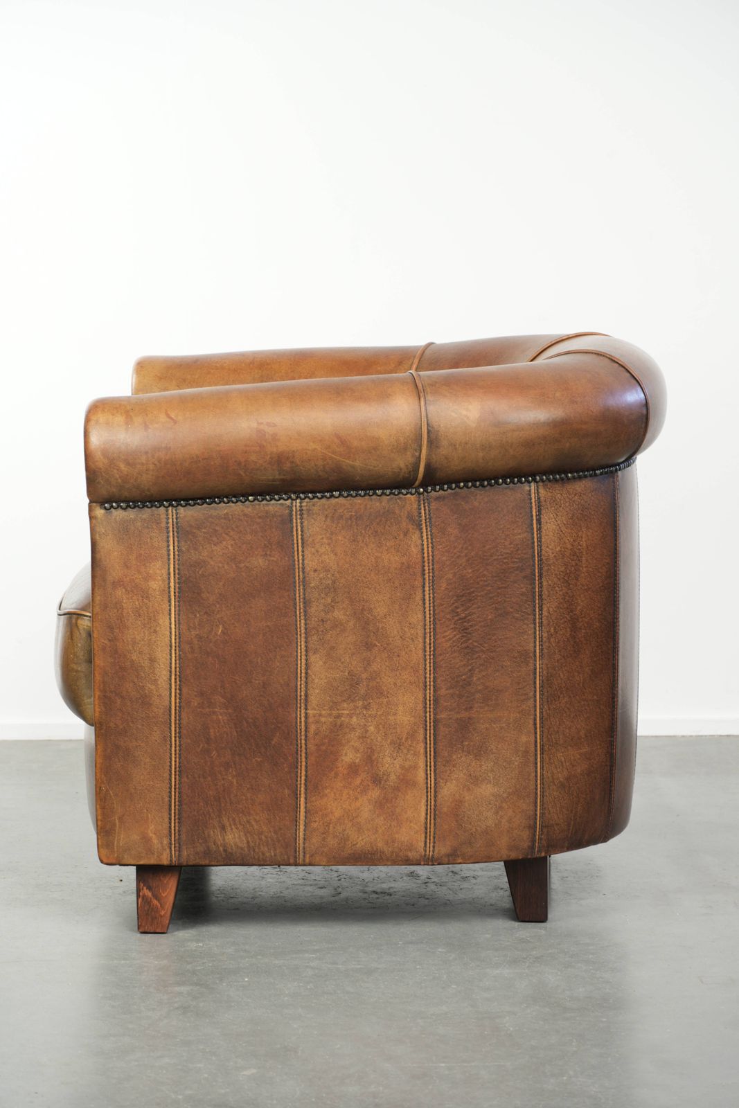 Sturdy And Characterful Sheepskin Club Armchair With A Beautiful Patina, Finished With Decorative Nails. photo 887.0