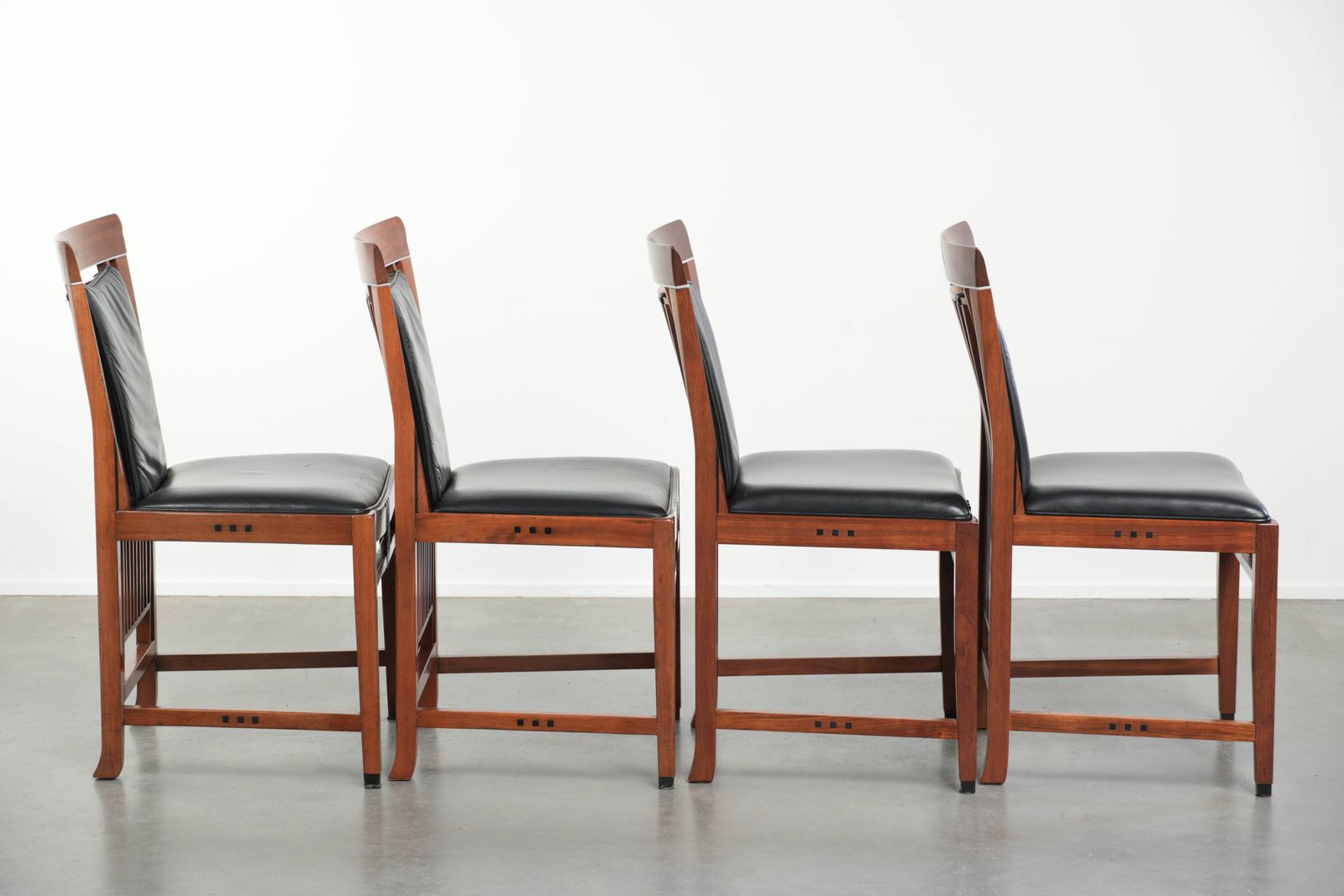 Elegant Set Of Four Black Cowhide Leather And Wood Art Deco Dining Chairs photo for sale