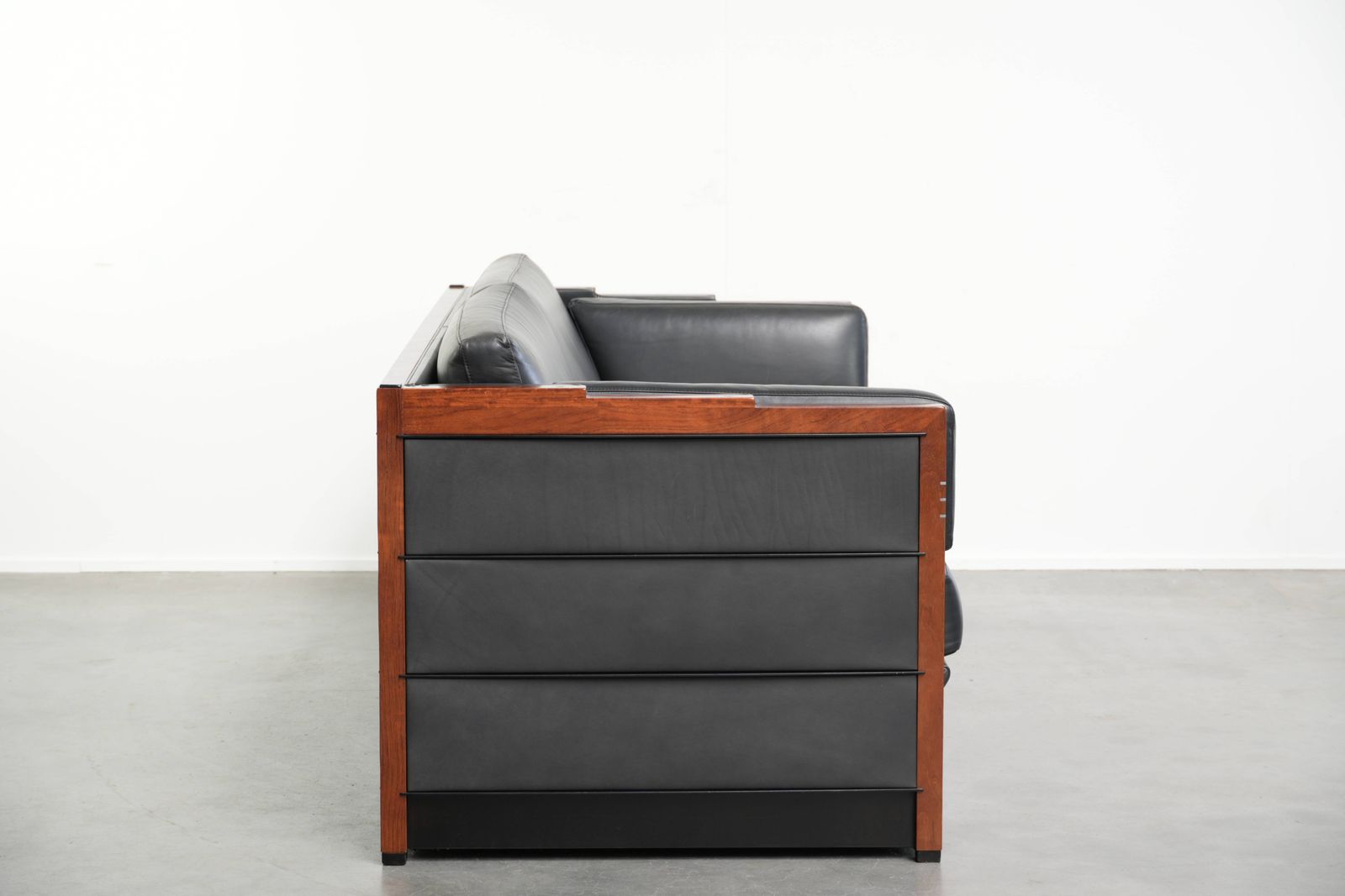 Timeless 3 Seater Art Deco Design Sofa Upholstered In Black Cowhide Leather And Finished With Wooden Details photo furniture
