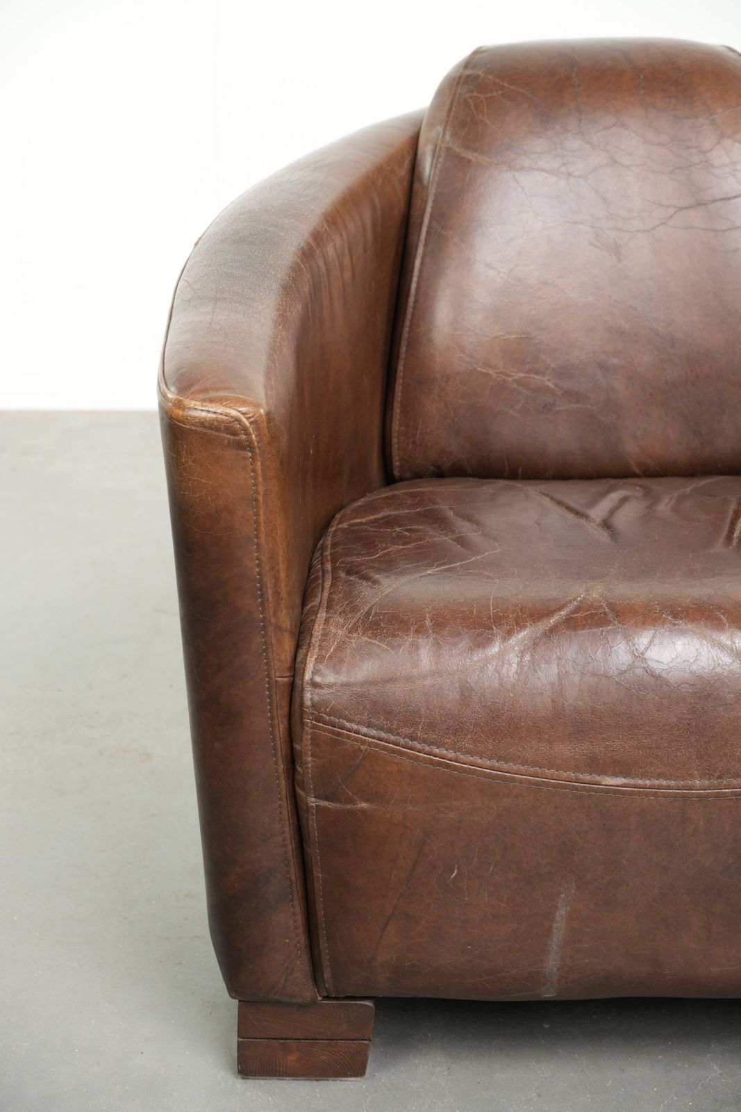 photo furniture Characterful And Robust Dark Cognac Brown Cowhide Leather Aviator Design Armchair With An Interesting Shape