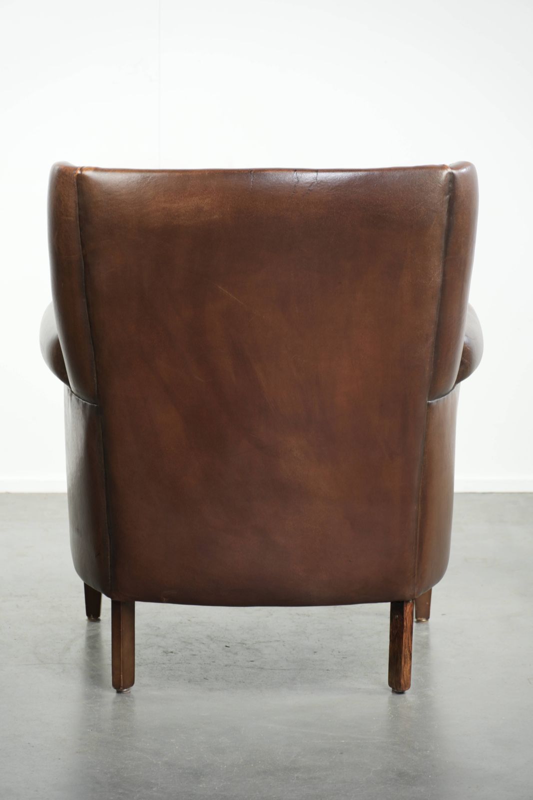 Beautiful, Subtle Sheepskin Wing Armchair With A Deep Cognac Color And A Comfortable Seat. photo Furniture