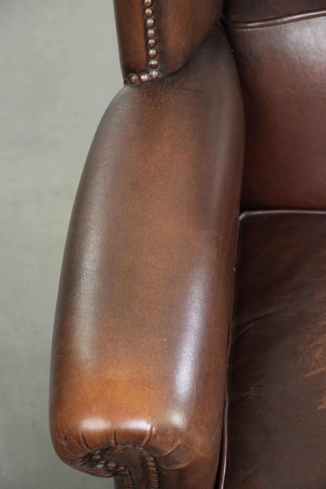 Beautiful, Subtle Sheepskin Wing Armchair With A Deep Cognac Color And A Comfortable Seat. photo buy