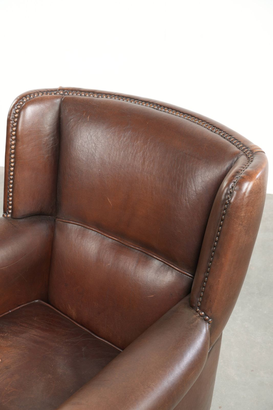 880.0 Beautiful, Subtle Sheepskin Wing Armchair With A Deep Cognac Color And A Comfortable Seat. photo