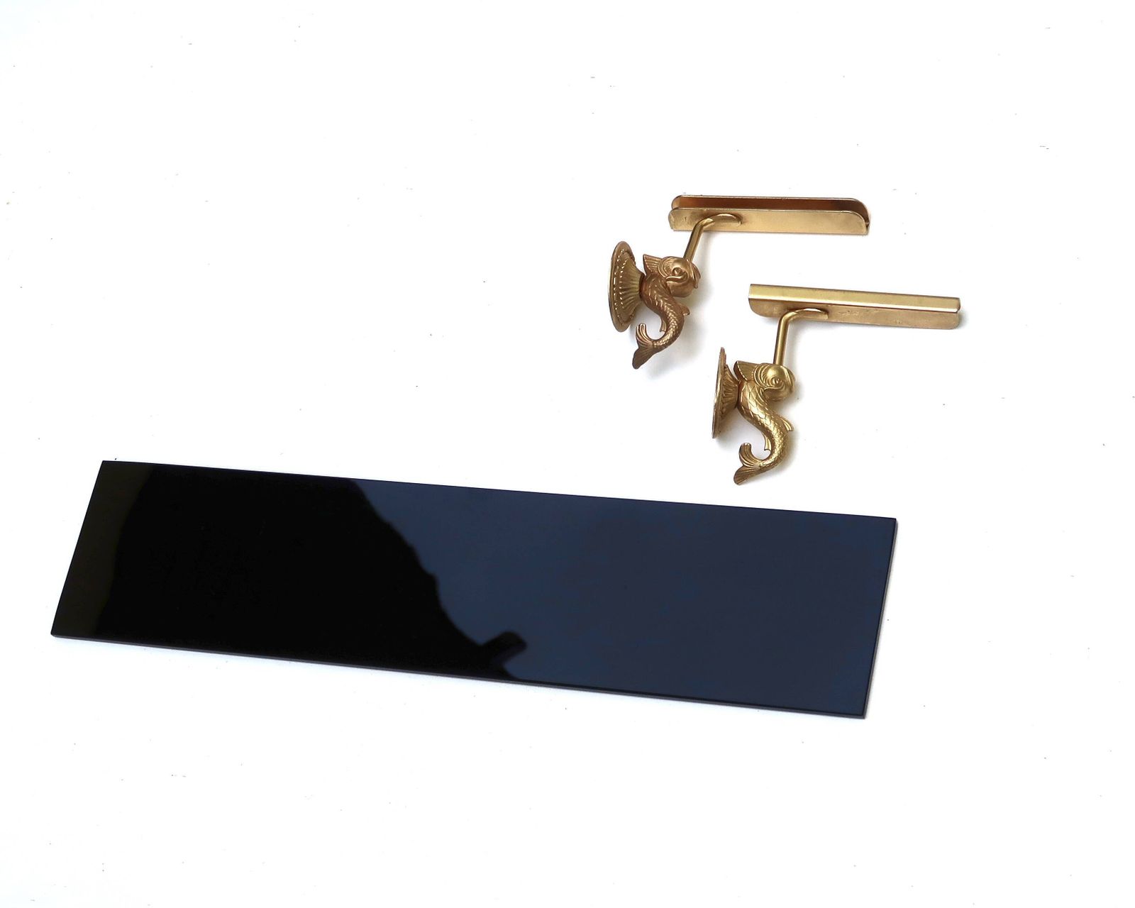 Wall Shelf In Gold Metal And Black Glass Adorned With Fish. photo 400.0