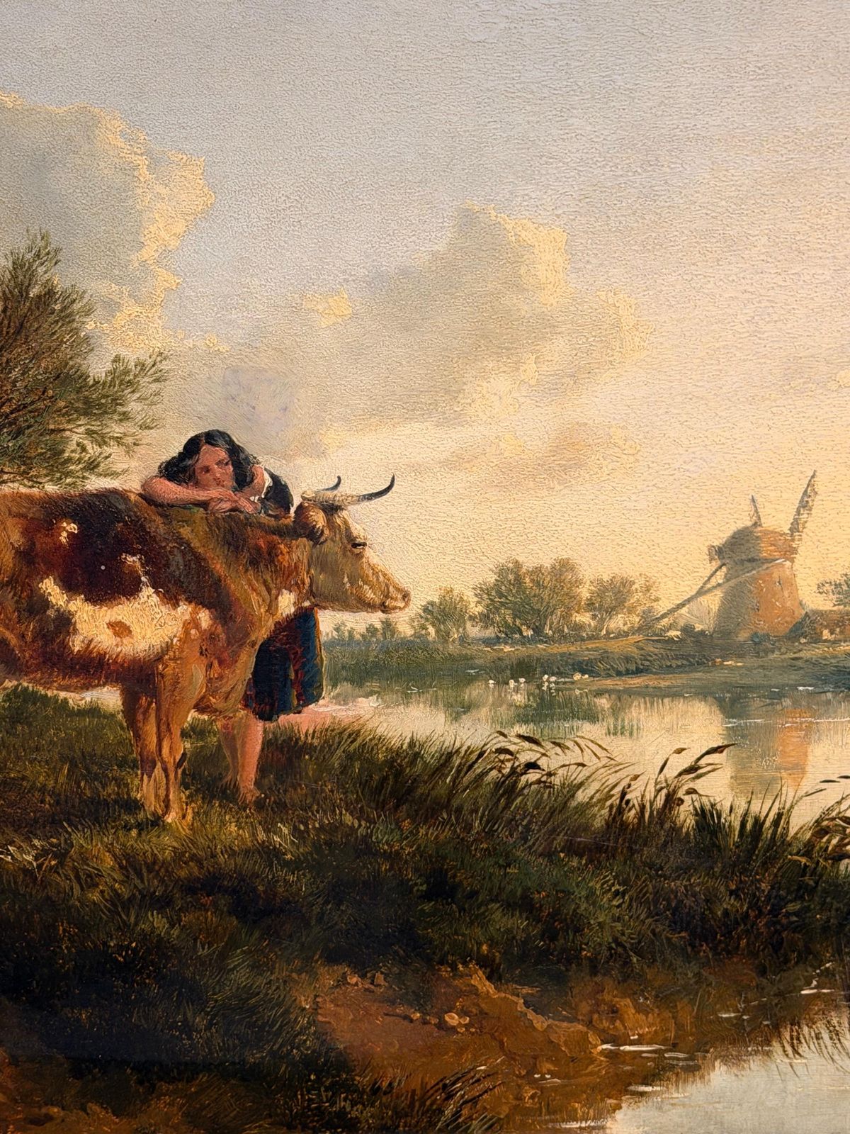 Paysage victorien britannique, bétail et jeune fille au bord d'un étang, coucher de soleil doré photo buy