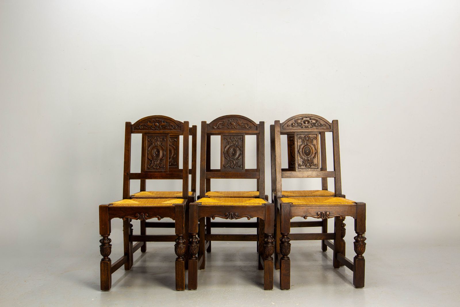 Six chaises de salle à manger en chêne espagnol, assises en jonc, vers 1950 photo for sale