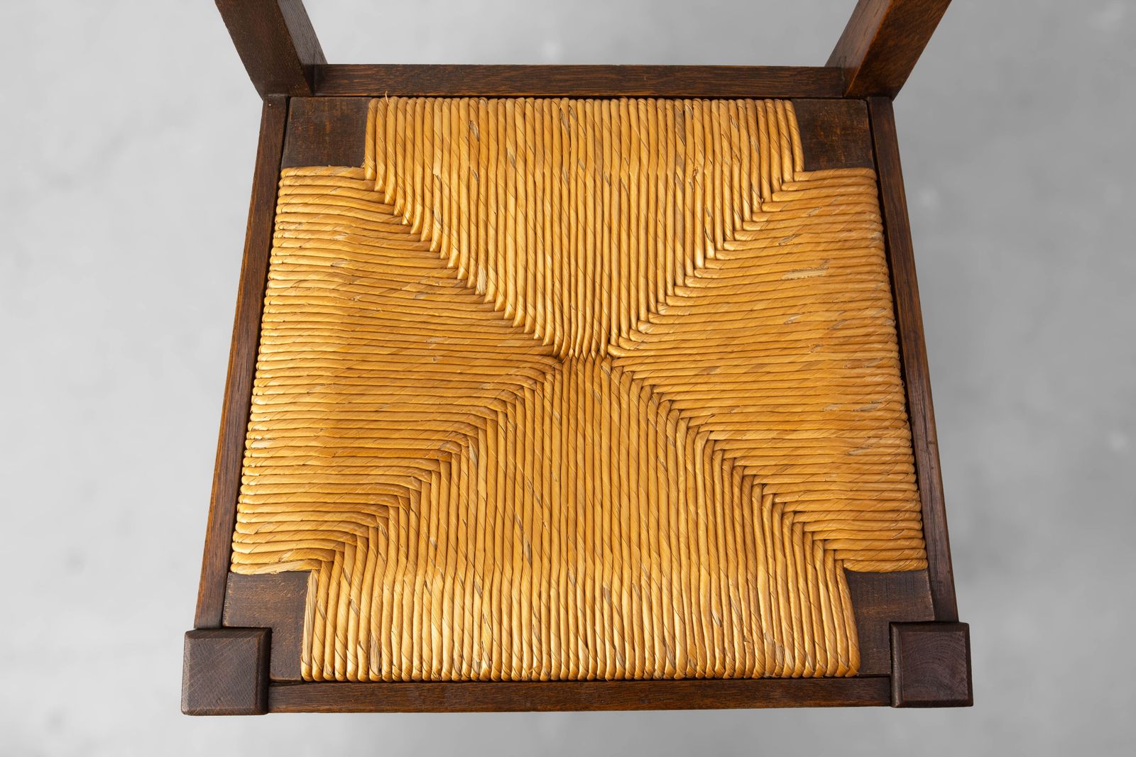 photo buy Six chaises de salle à manger en chêne espagnol, assises en jonc, vers 1950