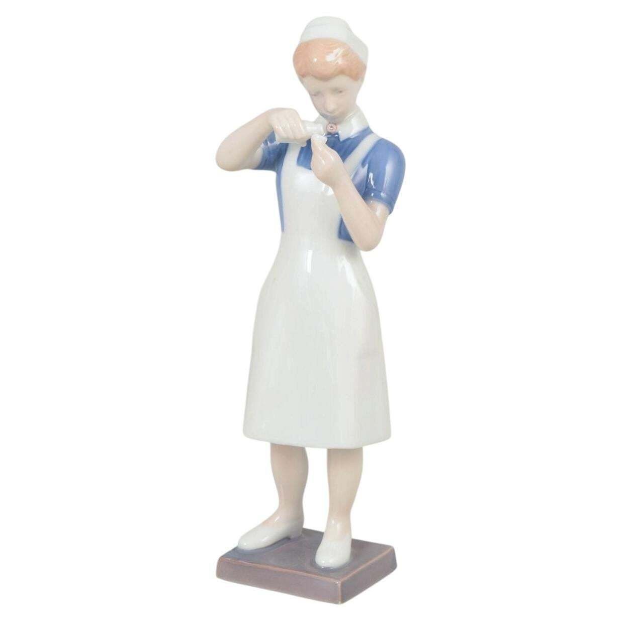 Bing & Grøndahl. Porcelain Figurine Of Nurse In Uniform. 1970s