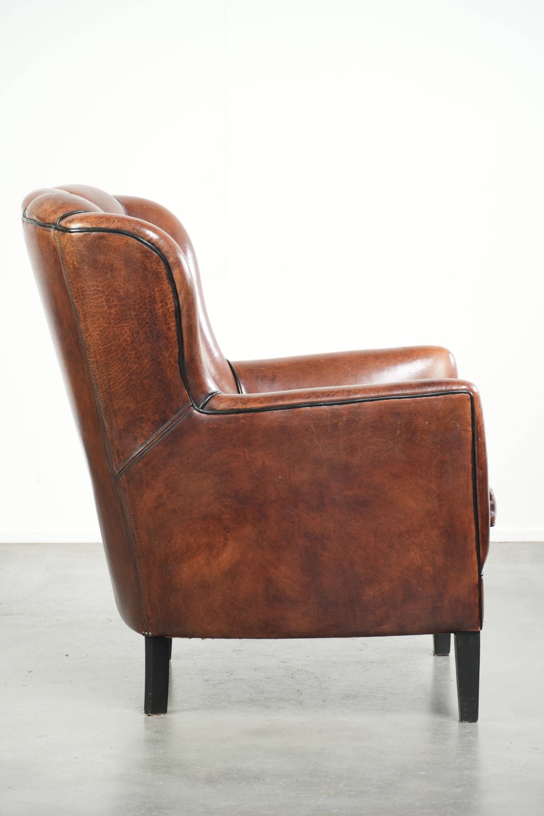 Comfortable Sheep Leather Armchair In A Unique Design Finished With Black Piping photo for sale