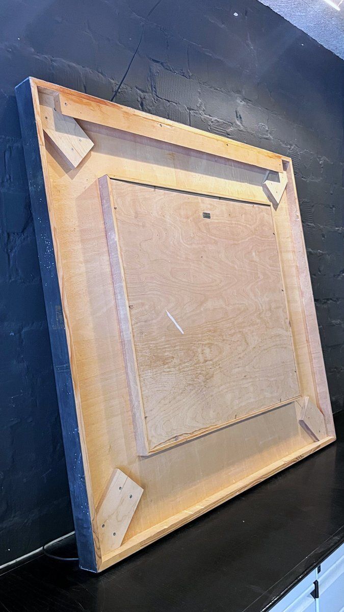 photo for sale Flamant spiegel met gebogen lijst van zinkplaat door Gunter Lambert