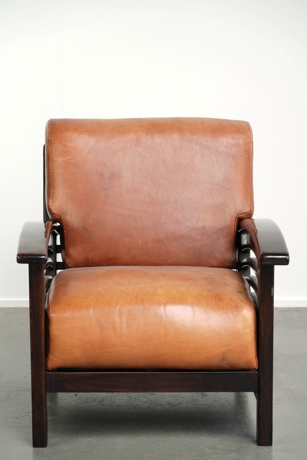 Elegant Cowhide Leather Armchair With Beautiful Details In A Timeless Art Deco Design photo furniture