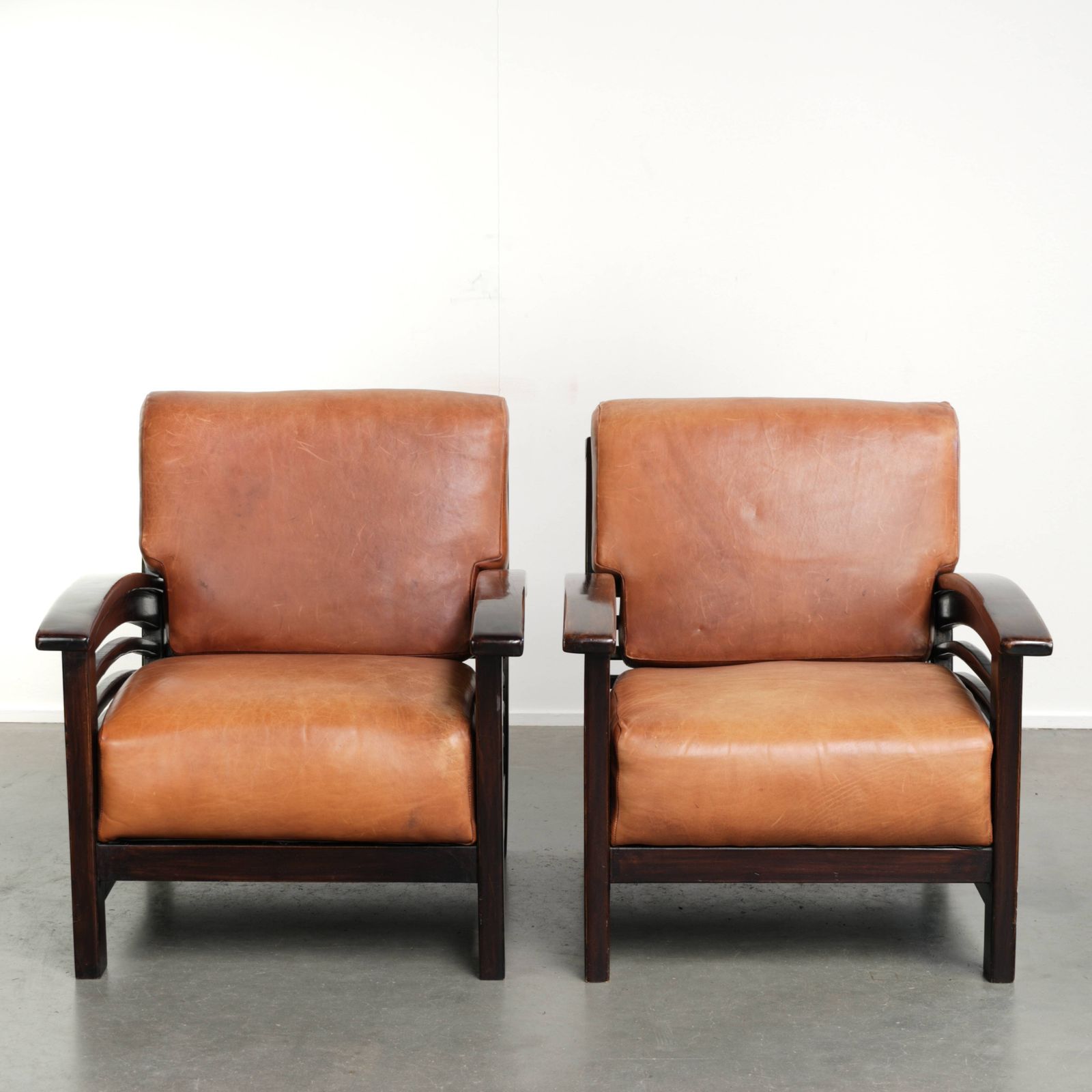 Desirable Set Of 2 Cognac Colored Cowhide Art Deco Armchairs From The 20th Century
