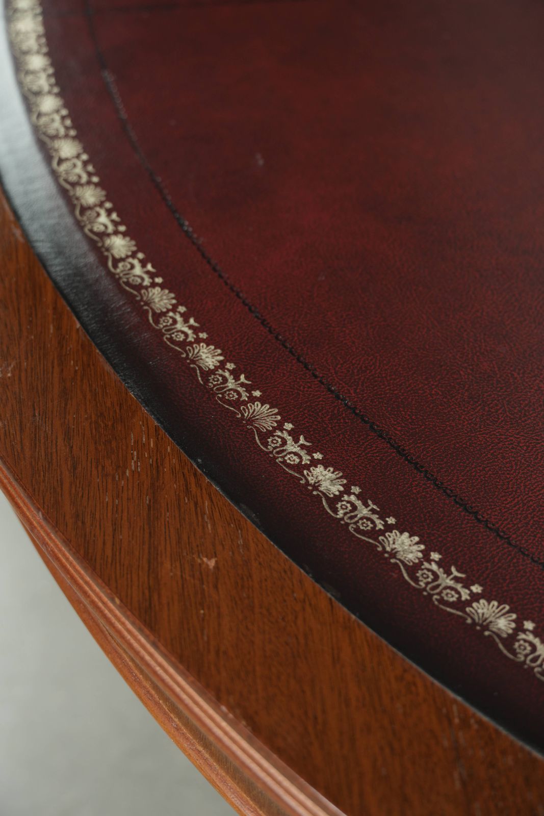 Elegant Oval Coffee Table With A Red Leather Top In English Style With Beautiful Details From The 20th Century photo buy