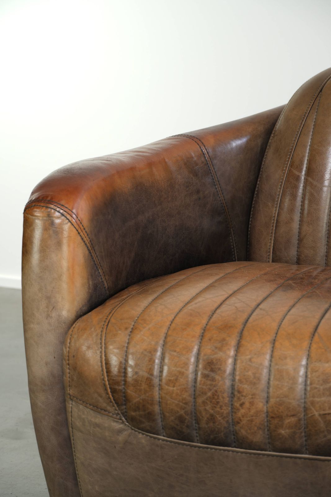 photo furniture Rugged And Characterful Cowhide Leather Aviator Design Club Armchair With A Unique Aluminium Finish