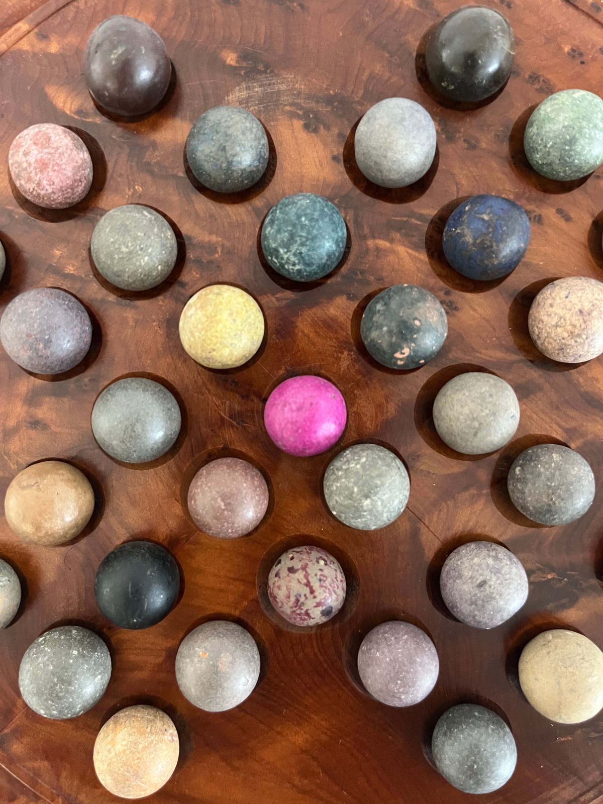 Marble Solitaire Board Game With 33 Handmade 19th Century Clay Or Stone Marbles. photo for sale